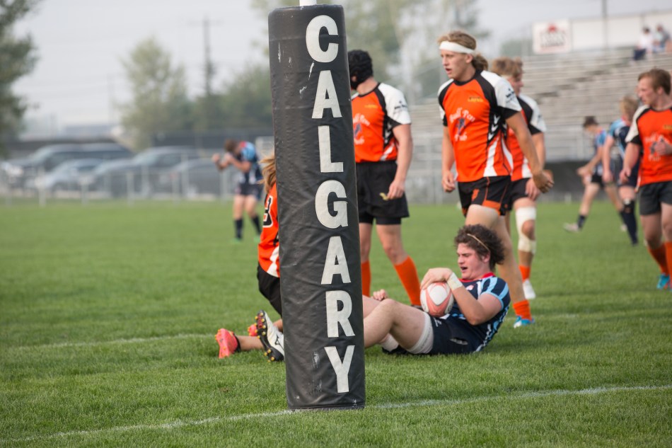 Final tackle of the game; Canucks win the Calgary rugby U18 city championships © J. Ashley Nixon