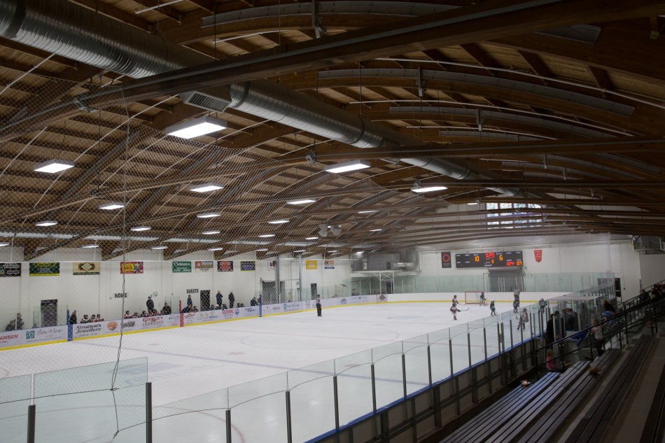 Curved roof beams were rescued from the old curling rink © J. Ashley Nixon