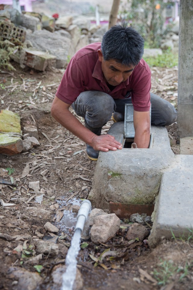 Vitoriano turns on the tap for his small dairy herd near Pachacamac, Peru #worldwaterday 2016 © J. Ashley Nixon
