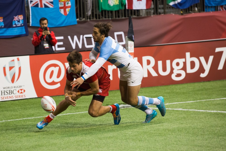Argentina's Bautista Delguay (#10) never stops tackling and forces a fumble by Russia's German Davydov (#12) over the try-line. © J. Ashley Nixon