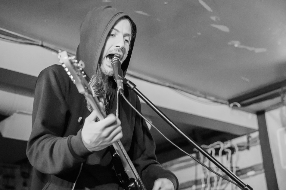 Andy March, vocalist with Crosss sings out from under the hood at The Palomino during the Sled Island Music Festival, Calgary, 2016 © J. Ashley Nixon