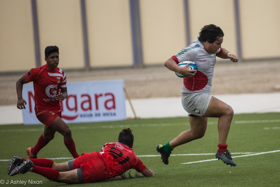 A Mexico U18 Serpents forward evades a last gasp tackle to score a try in the international game versus Peru in Chiclayo, Lambayeque, Peru © J. Ashley Nixon