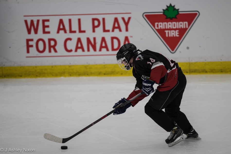 Action from the Bantam 1-B Final: Calgary Girls Hockey White Hawks versus Saskatoon Comet Impact at the Canadian Tire Wickenheiser World Female Hockey Festival, WinSport Arenas, Calgary, Canada © J. Ashley Nixon