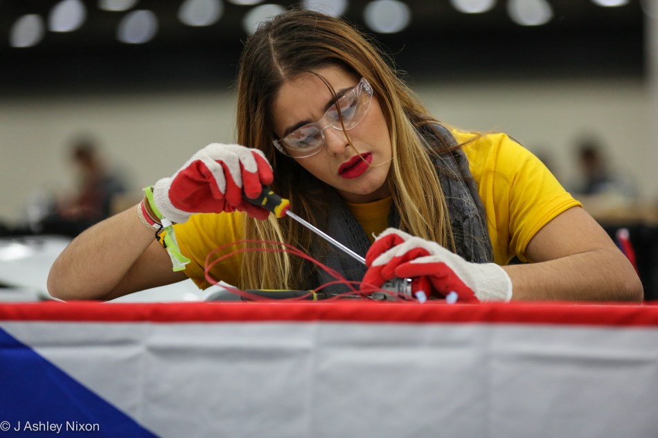 An engineering student from the Inter-America University of Puerto Rico preparing her team's vehicle for the Shell 2016 Americas Eco-marathon in the Cobo Center, Detroit, USA