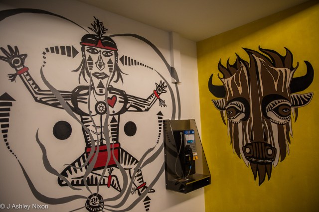 Sundancer and Buffalo. Two wall paintings by Indigenous (Blackfoot) artist, Ryan Jason Allen Willert HeavyShield, at Mount Royal University, Calgary, Canada. © J. Ashley Nixon