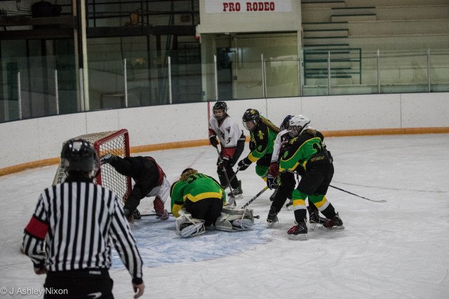 Hockey tumble in Stavely, home of Canada's First Indoor Rodeo. Calgary Girls Hockey Bantam 1 White Hawks came out winners against Okotoks. © J. Ashley Nixon