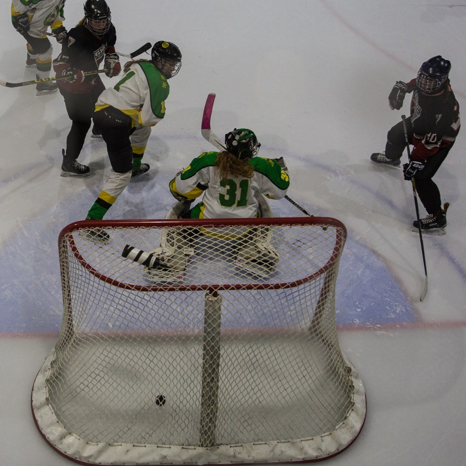 Calgary Girls Hockey Hawks score their second goal against Okotoks Oilers at the Scott Seaman Sports Rink, Millarville, Alberta, Canada. © J. Ashley Nixon