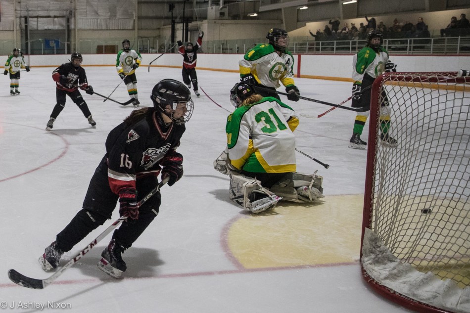 Centre Maddy Noonan scores her second goal for the Calgary Girls Hockey Bantam White Hawks against the Okotoks Oilers in the first round of the Calgary City hockey championships in Black Diamond, Alberta, Canada. © J. Ashley Nixon